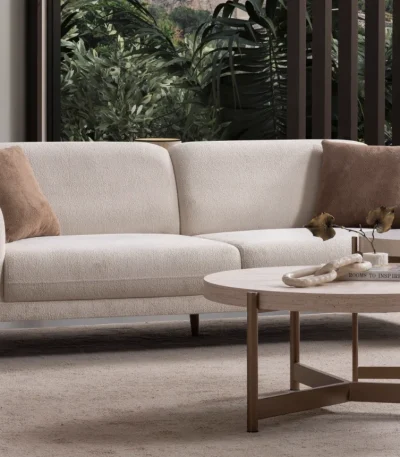Elora Sofa functional modern living room couch featuring soft rounded armrests and integrated reclining mechanism.