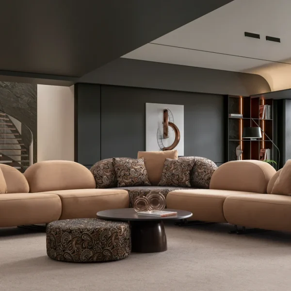 Tolia Corner Sofa - 5 Modules five-piece modular curved corner sofa featuring warm beige seating, patterned accent cushions, and an integrated wooden console table.