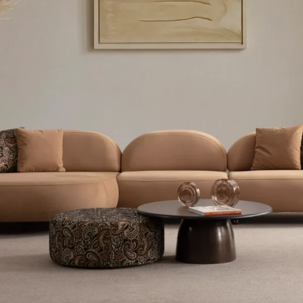 Tolia Chaise Corner Sofa - 3 Module three-piece modular curved sofa featuring an extended chaise end, warm beige upholstery, and plush decorative cushions.