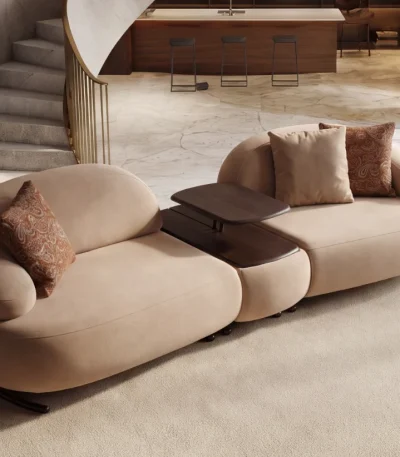Tolia Sofa (With Mid. Wooden Module) modular beige sofa featuring organic curved seats and an integrated central wooden console table.