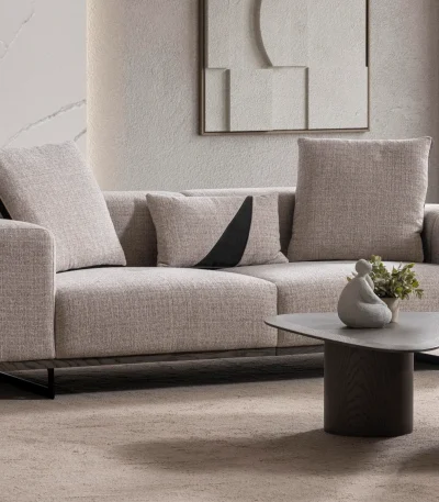 A modern textured fabric Nova Sofa featuring deep seating cushions, adjustable plush backrest pillows, channel-tufted wide armrests, and sleek low-profile metal legs in a minimalist room interior.