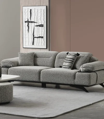 The elite Coaley Sofa featuring grey textured upholstery and sleek black legs, arranged in a high-end, modern living room that embodies a prestigious and balanced lifestyle.