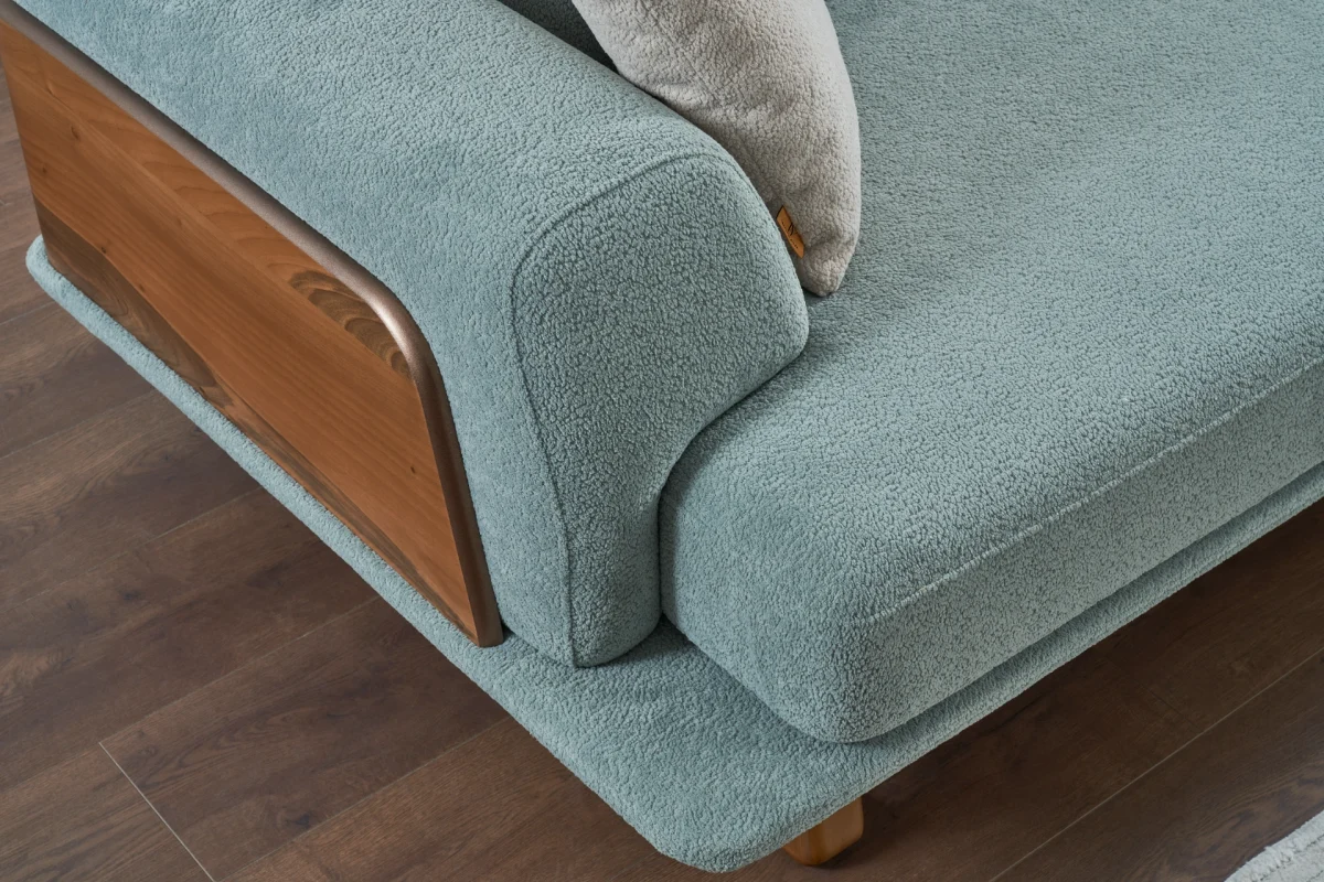 The Echo Sofa combines architecture with the soothing touch of fabric. A timeless piece designed for superior comfort and minimalist elegance in your living room.