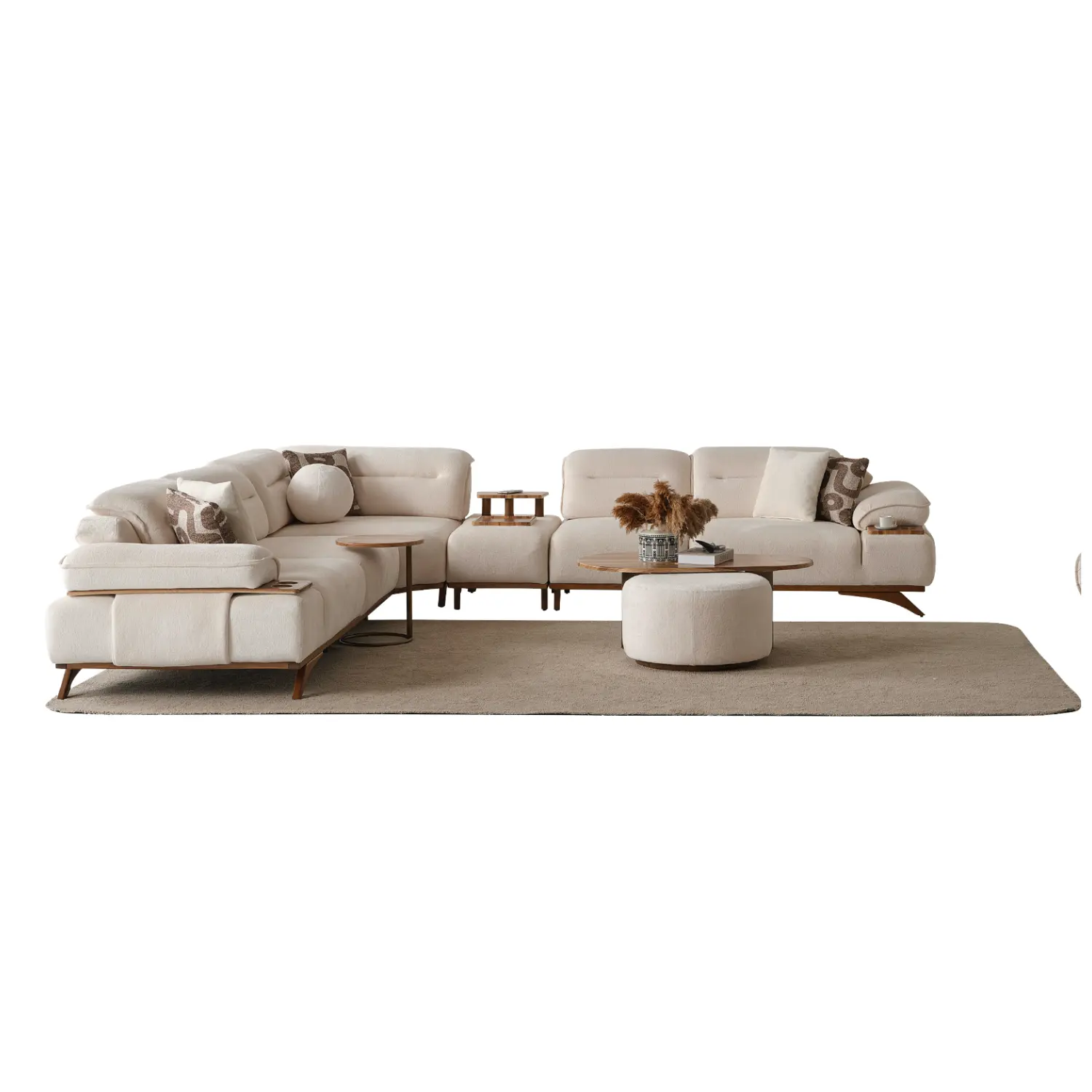 Grace-Corner-Sofa-Best-Furniture-From-Turkey-1 A modern living room featuring the Grace Sofa. The arrangement displays a plush taupe sofa and a matching cream sofa, both designed with distinctive integrated wooden side tables on the armrests and angled wooden legs. A white swivel armchair and a round wooden coffee table complete the cozy, contemporary look of this furniture from Turkey.