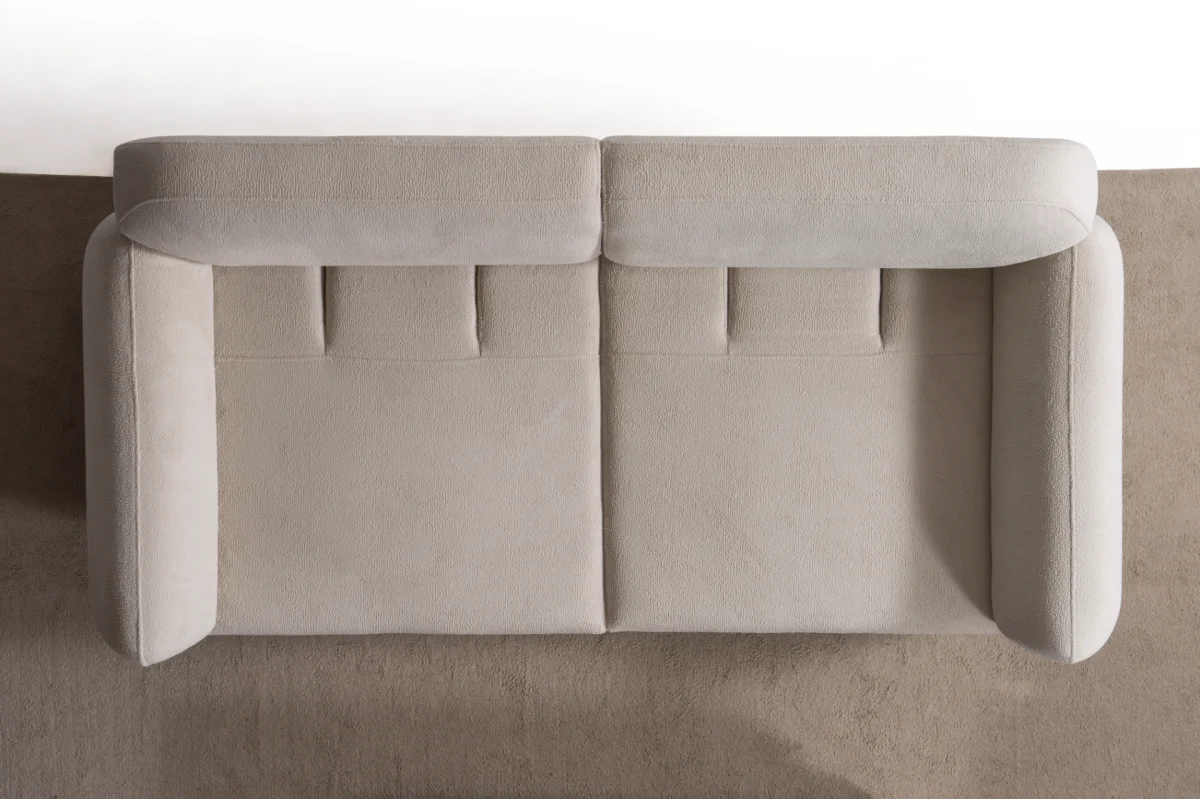 Modern rounded sofa with white boucle fabric and wooden base, luxury turkish furniture.