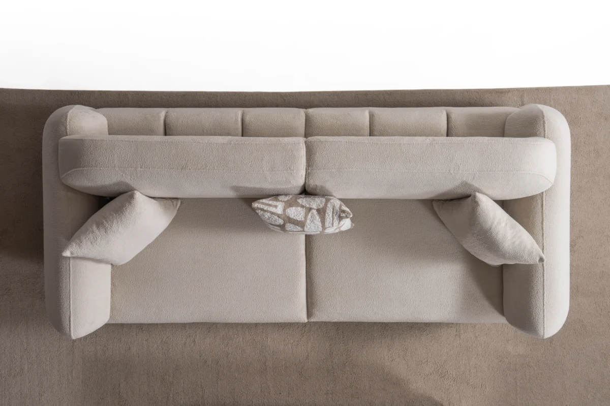 Modern rounded sofa with white boucle fabric and wooden base, luxury turkish furniture.