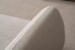 Modern rounded sofa with white boucle fabric and wooden base, luxury turkish furniture.