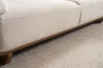 Modern rounded sofa with white boucle fabric and wooden base, luxury turkish furniture.