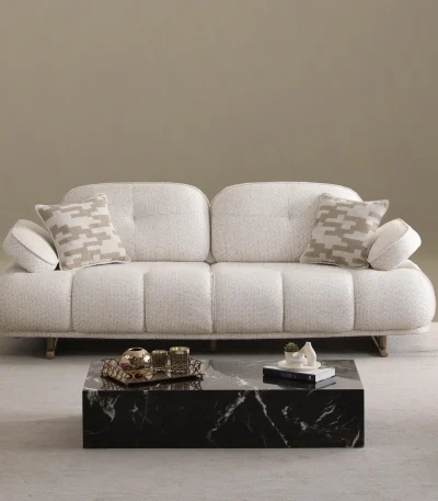 The elite Levni Sofa arranged in a high-end, modern living room with sophisticated wall paneling and artistic lighting, embodying a prestigious and balanced lifestyle.