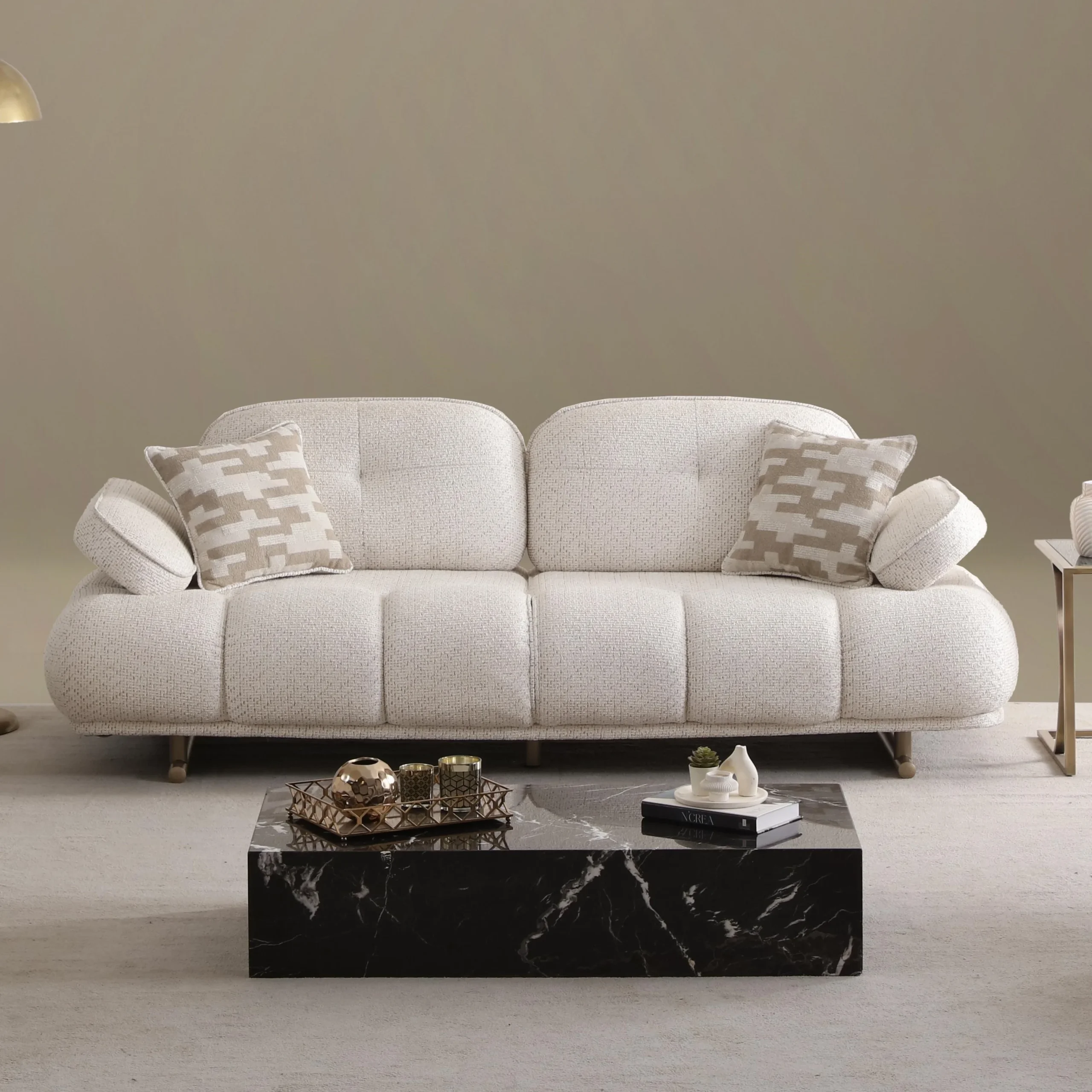Levni Sofa - Soft and durable Sofa - Elite modern furniture from Turkey 9 The elite Levni Sofa arranged in a high-end, modern living room with sophisticated wall paneling and artistic lighting, embodying a prestigious and balanced lifestyle.