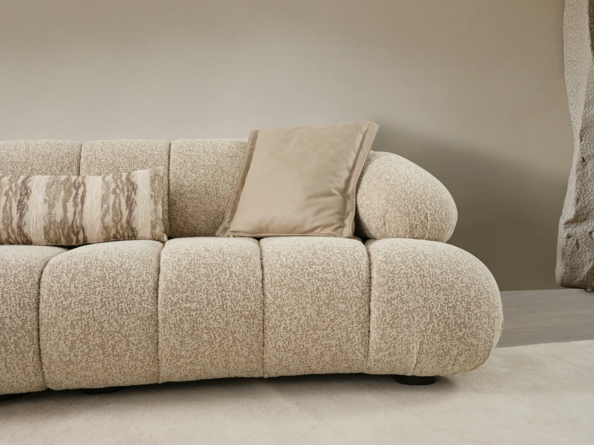 The Loris Sofa brings sculptural elegance to your home. With its signature texture and soft fabric, it offers a sophisticated relaxation experience for contemporary living.