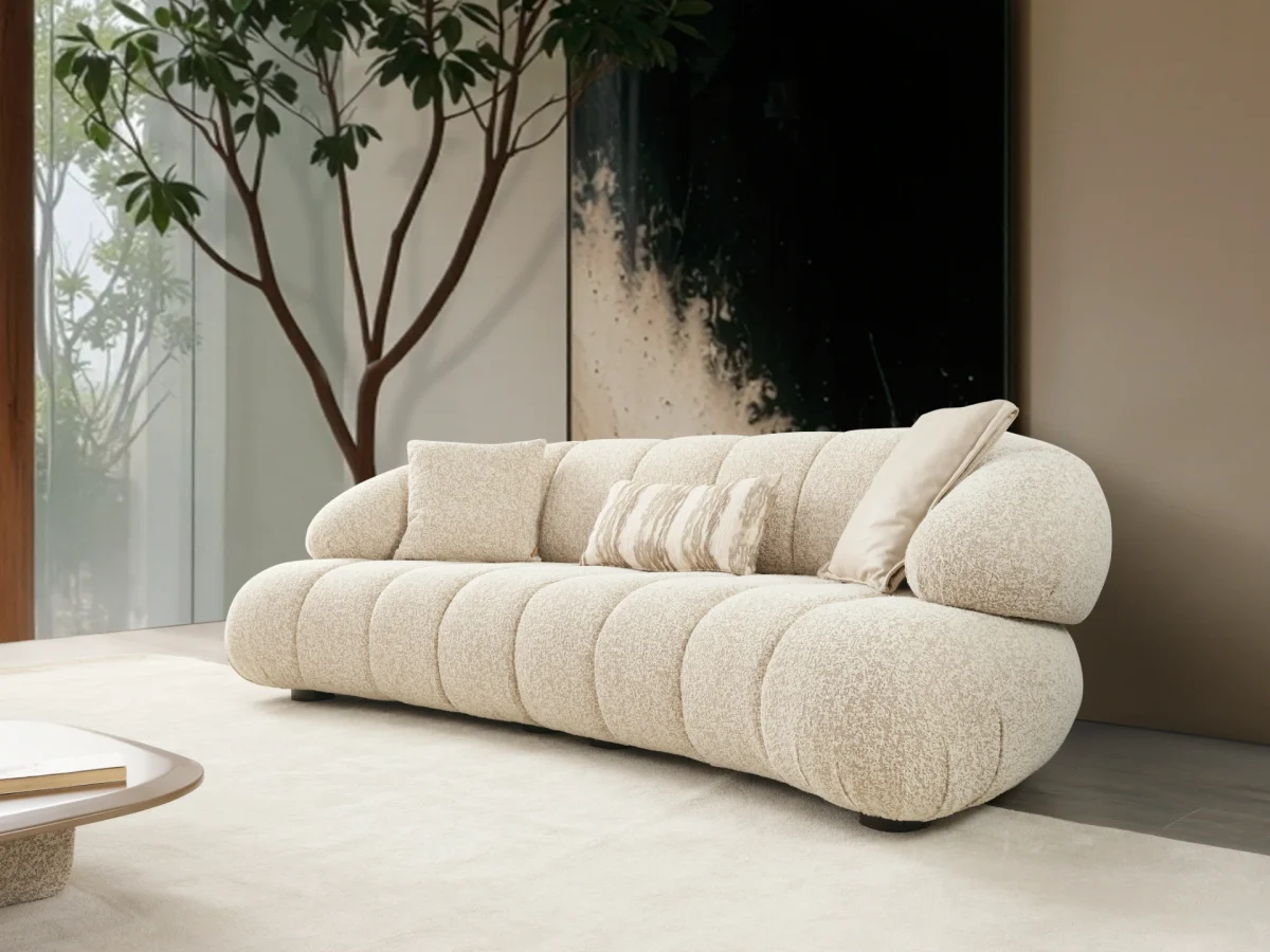 The Loris Sofa brings sculptural elegance to your home. With its signature texture and soft fabric, it offers a sophisticated relaxation experience for contemporary living.