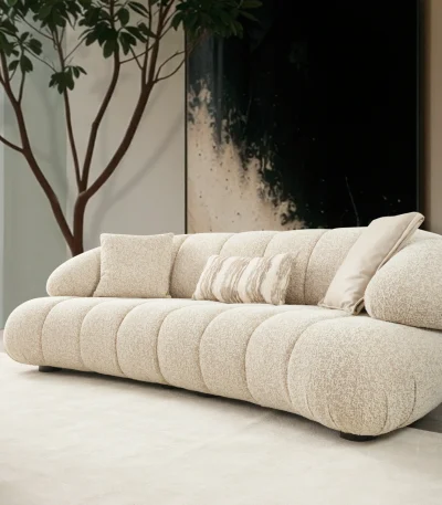 The Loris Sofa brings sculptural elegance to your home. With its signature texture and soft fabric, it offers a sophisticated relaxation experience for contemporary living.