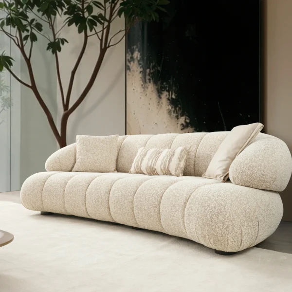 The Loris Sofa brings sculptural elegance to your home. With its signature texture and soft fabric, it offers a sophisticated relaxation experience for contemporary living.