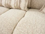 The Loris Sofa brings sculptural elegance to your home. With its signature texture and soft fabric, it offers a sophisticated relaxation experience for contemporary living.