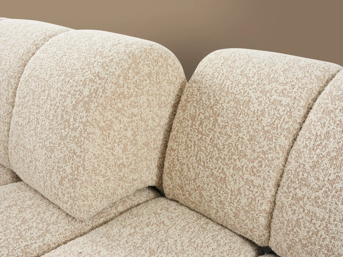 The Loris Sofa brings sculptural elegance to your home. With its signature texture and soft fabric, it offers a sophisticated relaxation experience for contemporary living.