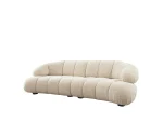 The Loris Sofa brings sculptural elegance to your home. With its signature texture and soft fabric, it offers a sophisticated relaxation experience for contemporary living.