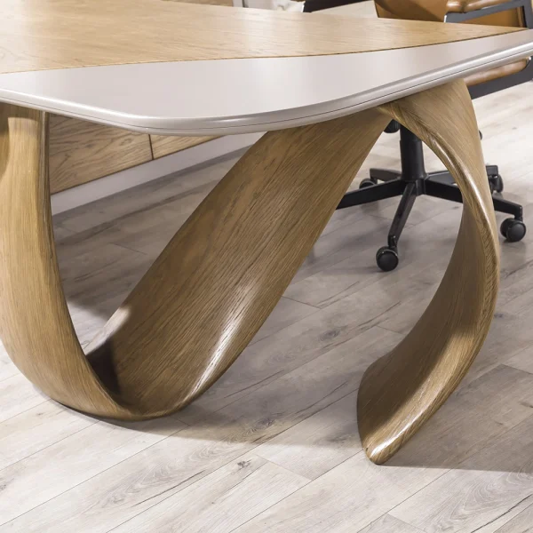 The Lumina Office Desk is where art meets high-performance work. With its signature infinity loop leg and integrated smart storage, it's the ultimate statement piece for modern leaders.