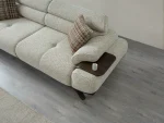 The Maya Sofa combines organic curves with functional luxury. With its fashionable texture and integrated side trays, it's the ultimate statement piece for modern European homes.