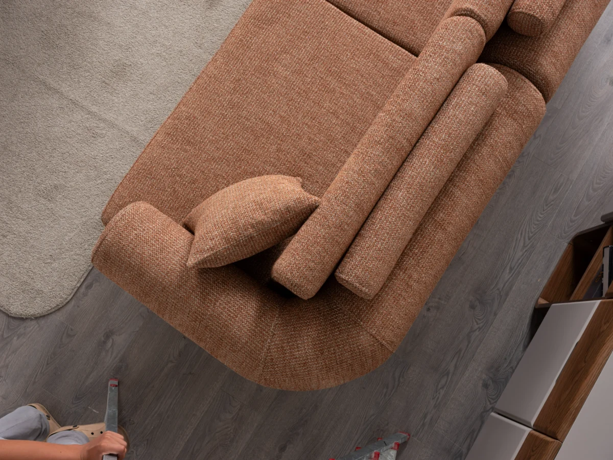 The Milan Sofa is an expression of modern elegance and organic design. This unique sofa is meticulously crafted for contemporary European homes. The rich, tactile fabric adds warmth and a high-end feel to any living space.