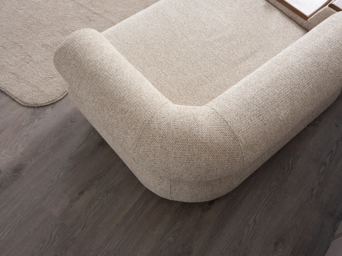 The Milan Sofa is an expression of modern elegance and organic design. This unique sofa is meticulously crafted for contemporary European homes. The rich, tactile fabric adds warmth and a high-end feel to any living space.
