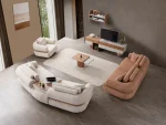 The Milan Sofa Set combines organic curves with elegant fabric textures. This modular masterpiece offers flexible seating arrangements.
