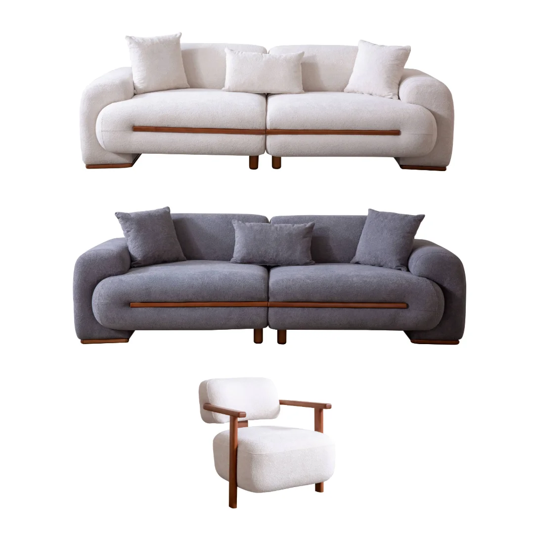 Nile Sofa Set - SofaTurkey Turkish Furniture Sets - Living Room Couch - 11 Nile Sofa Set featuring a large cream-colored bouclé sofa, a matching grey loveseat, and a stylish accent chair with wooden arms. The furniture is arranged in a high-end modern interior with textured stone walls and artistic lighting.