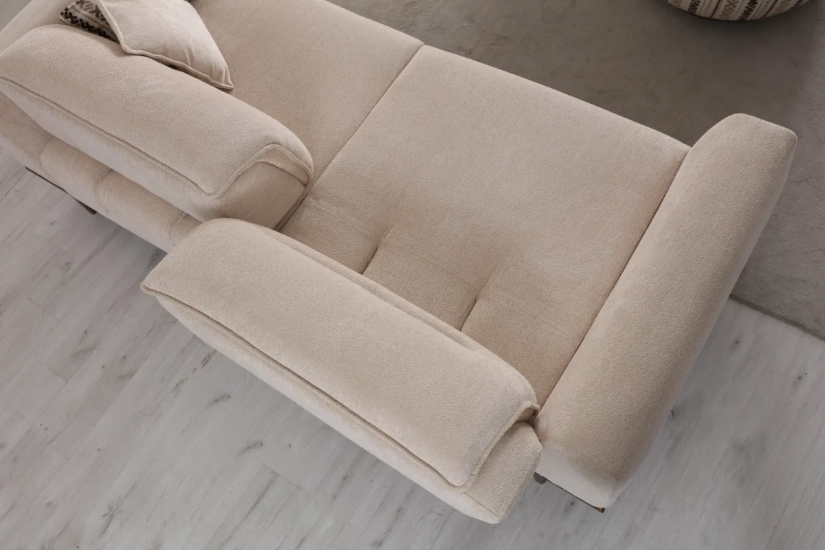 The Noa Sofa is a masterpiece of contemporary Turkish craftsmanship, designed exclusively for distinguished European homes. Its fluid, organic silhouette is upholstered in high-quality fabric that invites you to relax. This sofa is more than just a piece of furniture; it's a style statement that adds an airy, modern feel to any living space.