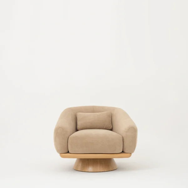 The Thalia Armchair offers a sophisticated seating experience, wrapped in rich, tactile fabric. Its base and seat create the perfect reading nook or decorative piece.