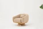 The Thalia Armchair offers a sophisticated seating experience, wrapped in rich, tactile fabric. Its base and seat create the perfect reading nook or decorative piece.