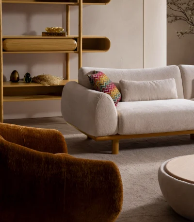 The Thalia Sofa combines organic, rounded lines with the rich texture of premium fabric. A bold piece that brings modern warmth to any living room.