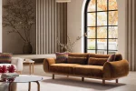 The Thalia Sofa combines organic, rounded lines with the rich texture of premium fabric. A bold piece that brings modern warmth to any living room.