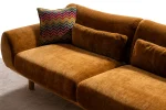 The Thalia Sofa combines organic, rounded lines with the rich texture of premium fabric. A bold piece that brings modern warmth to any living room.