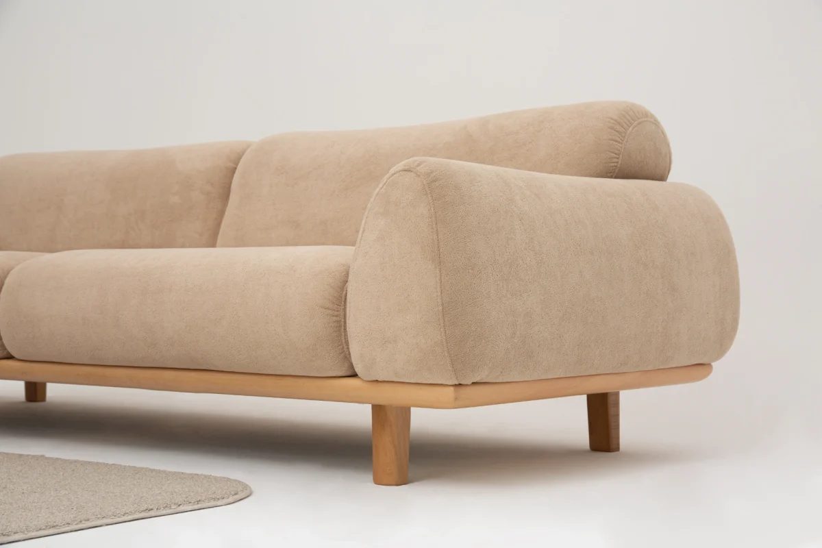 The Thalia Sofa combines organic, rounded lines with the rich texture of premium fabric. A bold piece that brings modern warmth to any living room.