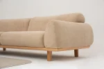 The Thalia Sofa combines organic, rounded lines with the rich texture of premium fabric. A bold piece that brings modern warmth to any living room.