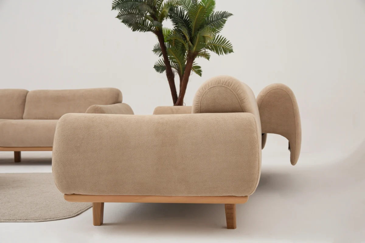 The Thalia Sofa combines organic, rounded lines with the rich texture of premium fabric. A bold piece that brings modern warmth to any living room.
