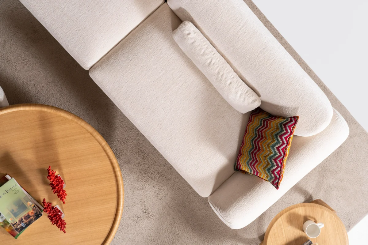 The Thalia Sofa combines organic, rounded lines with the rich texture of premium fabric. A bold piece that brings modern warmth to any living room.