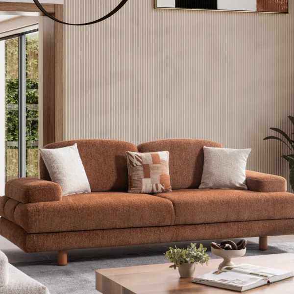 Modern living room featuring the Troyas sofa set in a warm terracotta hue, showcasing soft curves and a textured finish for a cozy, contemporary aesthetic – SofaTurkey.