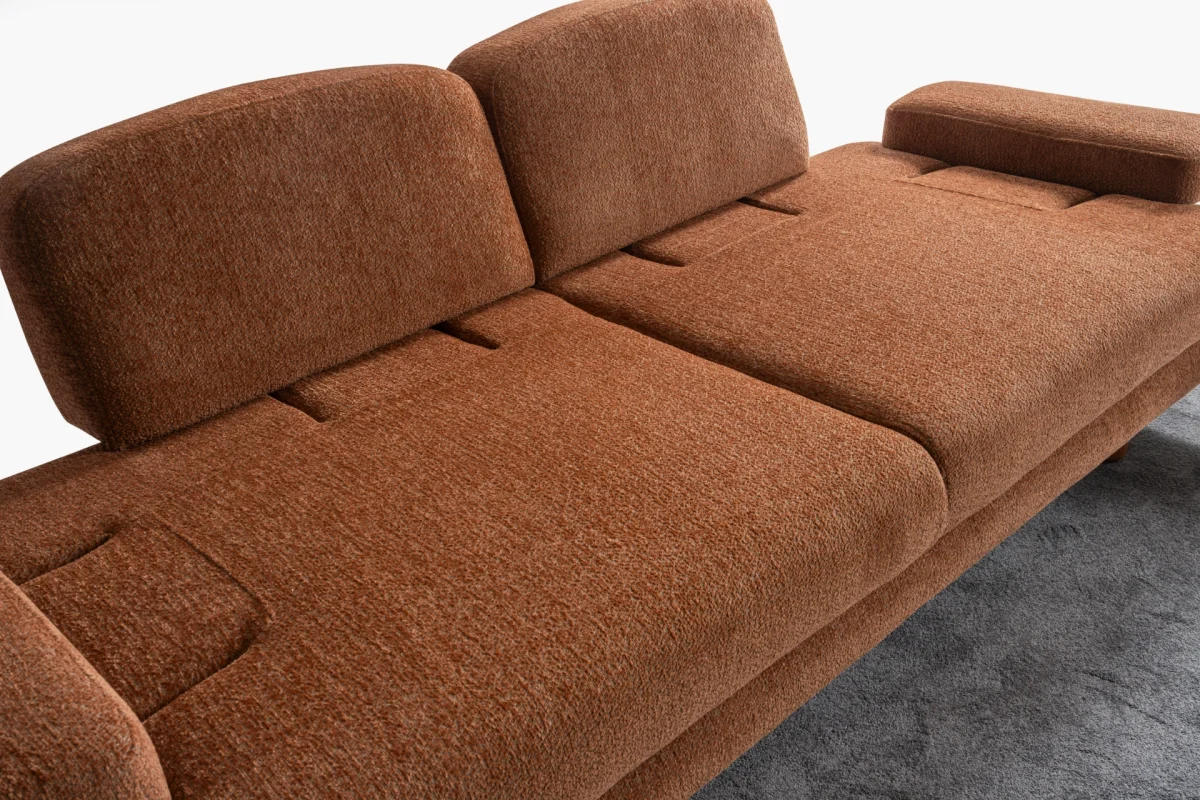 Modern living room featuring the Troyas sofa set in a warm terracotta hue, showcasing soft curves and a textured finish for a cozy, contemporary aesthetic – SofaTurkey.
