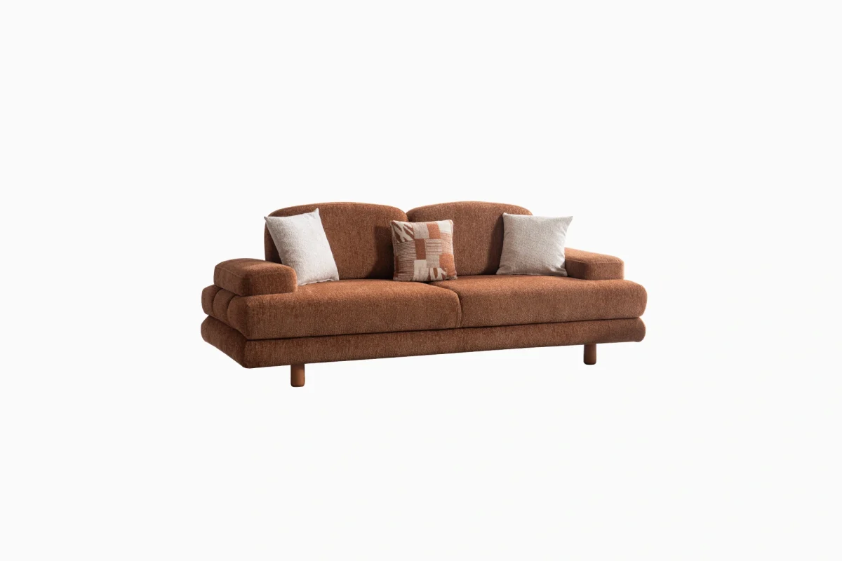 Modern living room featuring the Troyas sofa set in a warm terracotta hue, showcasing soft curves and a textured finish for a cozy, contemporary aesthetic – SofaTurkey.