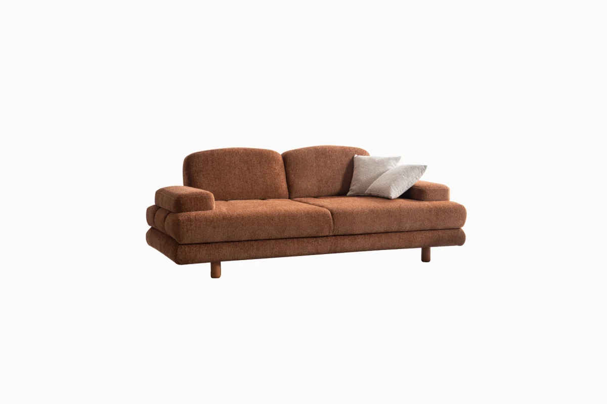 Modern living room featuring the Troyas sofa set in a warm terracotta hue, showcasing soft curves and a textured finish for a cozy, contemporary aesthetic – SofaTurkey.