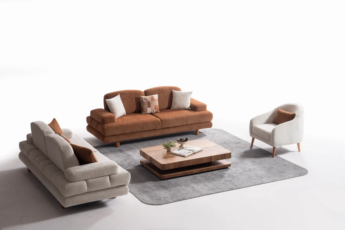 A harmonized Troyas sofa set showcasing a visual dialogue between warm terracotta and ivory tones, featuring matching organic curved silhouettes in a luxury contemporary setting – SofaTurkey.