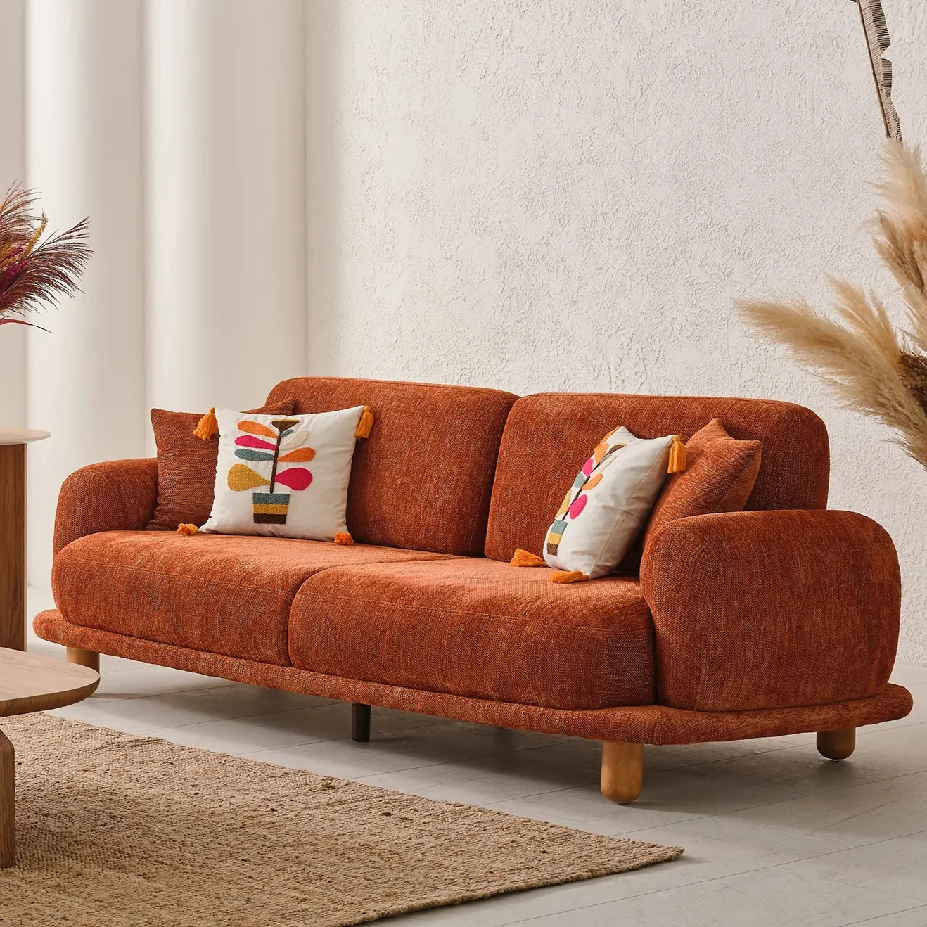 Vira Sofa Set - Comfortable and Ergonomic Sofa Set with Wooden Details 4 A vibrant Vira Sofa Set placed in a bright, minimalist room with organic shapes, designed to evoke a sense of warmth, creativity, and modern comfort.