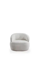 The Vogue Armchair is a masterpiece of organic design. Its soft fabric offers cocoon-like comfort, elevating any modern interior.