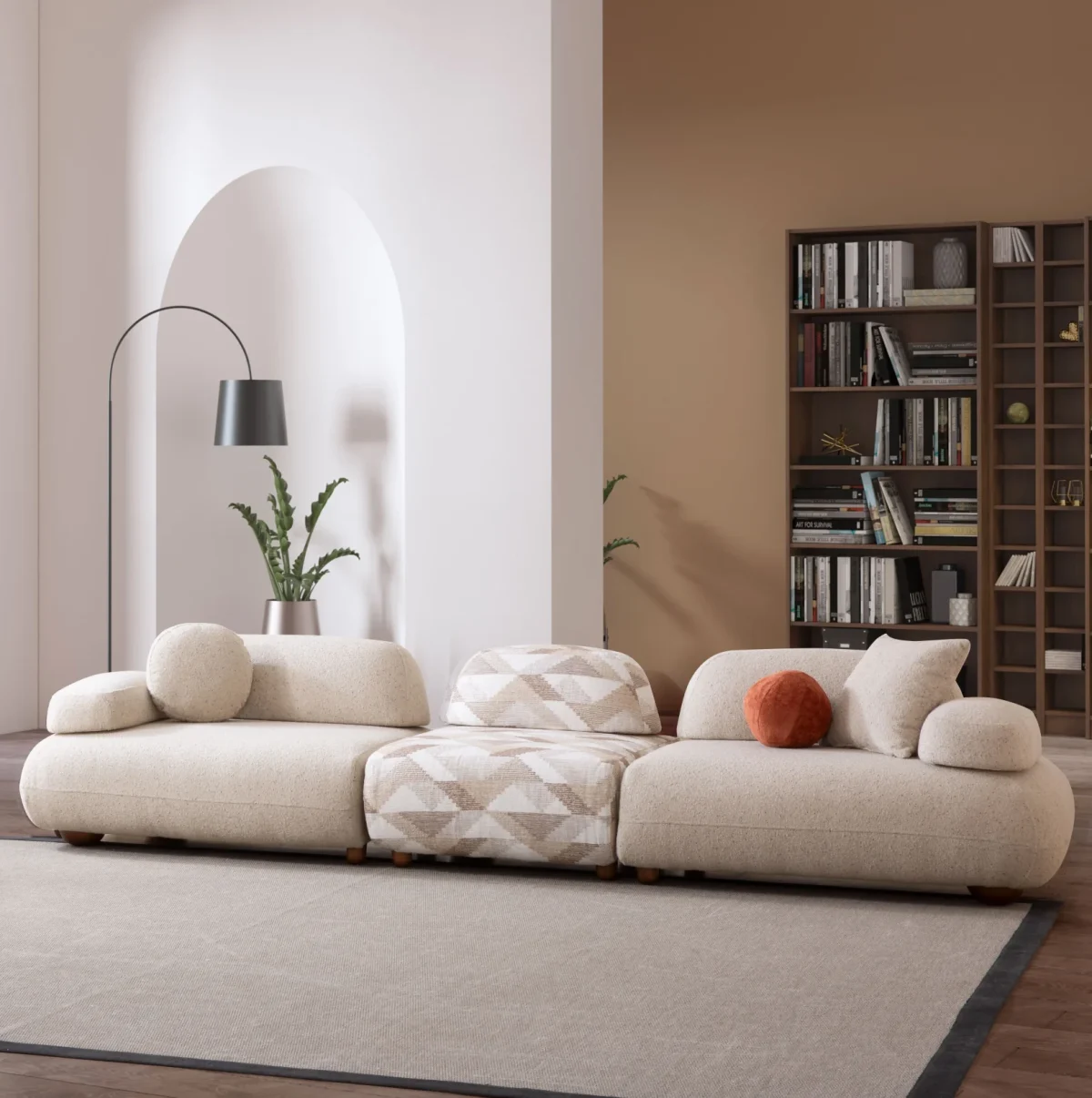 Alba XL Sofa Set featuring a large cream bouclé sectional, a matching loveseat, and a geometric patterned accent chair. The set is arranged in a spacious, modern room with high ceilings, an arched alcove, and a large library bookshelf.