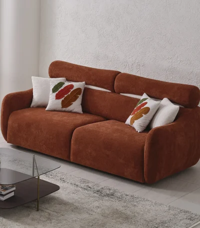 The vibrant Amora Sofa featuring textured white, orange, and grey seating in a bright, modern minimalist room, designed to create an energetic and artistic atmosphere.