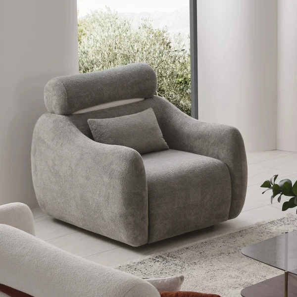The vibrant Amora Armchair featuring textured white, orange, and grey seating in a bright, modern minimalist room, designed to create an energetic and artistic atmosphere.