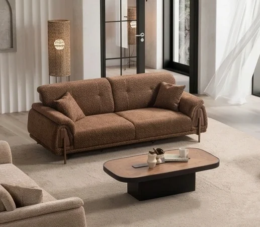 Aria sofa set premium and functional sofa set Sofaturkey living room furniture sofa from Turkiye 2 1 A modern textured fabric sofa featuring linear tufted backrest detailing, soft rounded side armrests supported by slim elegant wooden-accent legs, set in a spacious high-ceiling living room environment.