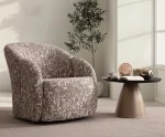 A modern tub-style accent armchair featuring a curved continuous barrel backrest, textured woven upholstery pattern, and a fully upholstered low-profile base set in a sunlit contemporary room layout.