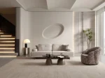 A modern tub-style accent armchair featuring a curved continuous barrel backrest, textured woven upholstery pattern, and a fully upholstered low-profile base set in a sunlit contemporary room layout.